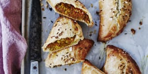 Spiced lentil and vegetable pasties sprinkled with cumin seeds.