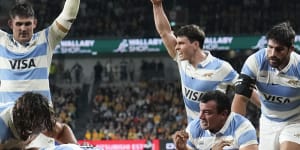 Argentinian players celebrate a try by teammate Juan Martin Gonzalez.