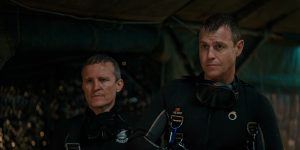 Damon Herriman (left),who plays Australian diver Craig Challen,with Corser on set. The actors practised cave diving in a pool by swimming under trestle tables. 