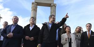 Greek Prime Minister Kyriakos Mitsotakis,centre,visits the Palace of Aigai which opens for visits from Sunday.