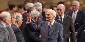 The Church of Jesus Christ of Latter-day Saints President Russell M. Nelson,centre,waves as he arrives during the Church of Jesus Christ of Latter-day Saints’ twice-annual church conference in Salt Lake City in April 2022