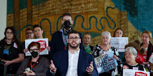 Greens Senator Jordon Steele-John alongside NDIS advocates during a post budget press conference at Parliament House.