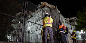 Construction workers set up additional fencing near the White House in Washington,D.C.,U.S.,on Monday,Nov. 2,2020. Temporary extra fencing is being erected around the White House,plywood affixed to storefronts in Manhattan and the National Guard put on notice in Portland,Oregon,as U.S. cities brace for possible unrest on election day. Photographer:Stefani Reynolds/Bloomberg