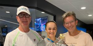 Ash Barty with coach Craig Tyzzer and mindset coach Ben Crowe after winning the Australian Open.