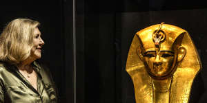 Photos of the installation of Gold Gilded mask from the coffin of Amenempe as part of the Rameses exhibition at The Australian Museum. Pictured is Australian Museum Director and CEO Kim McKay 