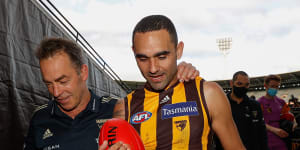 Alastair Clarkson and Shaun Burgoyne leave the MCG for the final time in Hawthorn colours. 