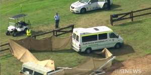 An ambulance at the scene of the accident where Caitlyn Fischer died competing in a cross-country event at the Sydney International Equestrian Centre.