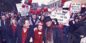 Mary Drost joined by actor Geoffrey Rush and the late comedian Barry Humphries at Camberwell Railway Station.