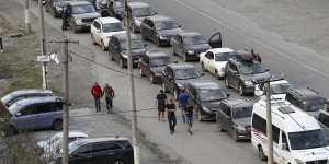 Cars queuing toward the border crossing at Verkhny Lars between Russia and Georgia,leaving Chmi,North Ossetia - Alania Republic,in Russia.