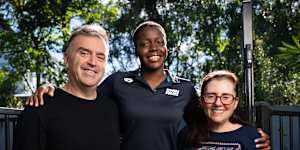 Commonwealth Games para-swimmer Victoria Belando Nicholson is photographed with her parents Ewan and Susana at their home in Brisbane.