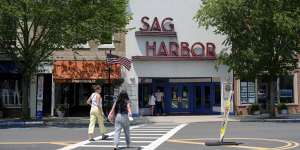 People walk along Main Street in Sag Harbor on Tuesday.