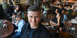 Bar owner Liam Ganley in his just-renovated Irish bar,which has remained busy.