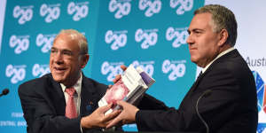 Former Treasurer Joe Hockey with OECD secretary-general Angel Gurria at the G20 Finance Ministers and Central Bank Governors Meeting in Cairns in 2014 when the OECD plan to stop multinational tax evasion was discussed.