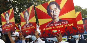 Engineers hold posters with an image of deposed Myanmar leader Aung San Suu Kyi as they hold an anti-coup protest march in Mandalay on Monday.