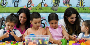 Amanda Ndaira with her children Gabriella,4,Milad,5,Grace,6,and Georgia,1,with Smart Start education director Michelle Tamaro (second from right).