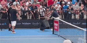 A snake catcher on court during Dominic Thiem’s match with James McCabe.