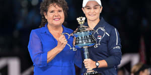 Evonne Goolagong Cawley presents Ash Barty with the 2022 Australian Open trophy.