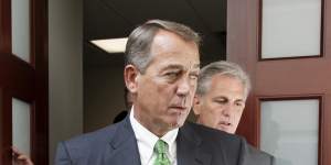 Stepping down ... House Speaker John Boehner,left,followed by House Majority Leader Kevin McCarthy,emerge from a meeting on Capitol Hill in Washington.