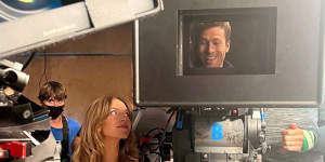 Sydney Sweeney and Glen Powell are all smiles on the set of their romcom.