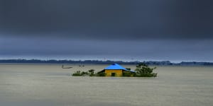 A house is marooned by flood waters in Sylhet,Bangladesh last month.