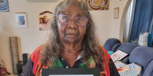 Doreen Webster holds a photo of her brother,Barkindji man Kevin Bugmy,who died in custody in 2019.