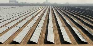 Solar panels at Mohammed bin Rashid Al Maktoum Solar Park and its solar tower in Dubai.