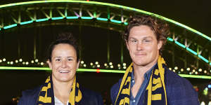 Michael Hooper and Shannon Parry pose in front of the Harbour Bridge after Australia was named host of the 2027 and 2029 World Cups.