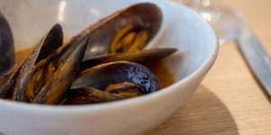 The go-to dish:Mussels in a warm tomato water.