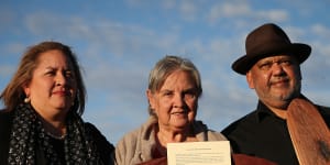 Megan Davis,Pat Anderson and Noel Pearson with a piti holding the Uluru Statement from the Heart in May 2017.