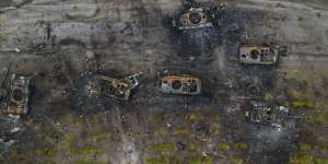 Destroyed Russian armoured vehicles sit on the outskirts of Kyiv.