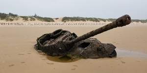 An abandoned American M18 army tank sitting in the sand at Ou Cuo Beach,in Kinmen.