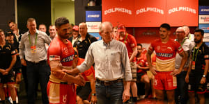 Wayne Bennett addresses his players in the sheds after the round one win over the Roosters.