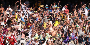 MCG fans,pictured mimicking Travis Head last summer,can watch a women’s Ashes Test next summer.