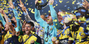 GOSFORD,AUSTRALIA - MAY 25:Danny Vukovic of the Central Coast Mariners holds aloft the Championship Trophy alongside team mates after winning the A-League Men Grand Final match between Central Coast Mariners and Melbourne Victory at Industree Group Stadium,on May 25,2024,in Gosford,Australia. (Photo by Mark Metcalfe/Getty Images)