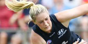 Harris tackles Justine Mules of the Adelaide Crows during the Round 4 AFLW match at Richmond Oval in Adelaide,March 1,2020. 