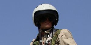 A Russian army pilot poses on the cockpit of a Su-25 jet fighter. Russian airstrikes have proved crucial in turning the tide against Syrian rebels backed by the CIA.