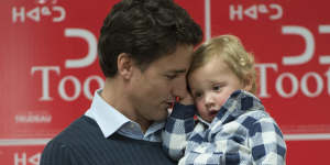 Trudeau holds his son Hadrien during a campaign event in Iqaluit,Nunavut.