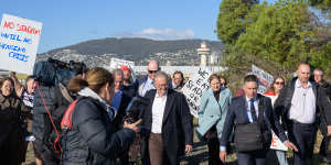 Protesters surround Prime Minister Anthony Albanese after he announced funding for a new stadium in Hobart.
