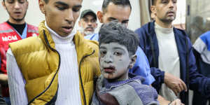 Palestinians injured in an Israeli airstrike arrive at Nasser Medical Hospital in Khan Younis,Gaza.