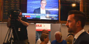 Zak Kirkup mingles with Liberal supporters after conceding while former leader Mike Nahan dissects the result on television.