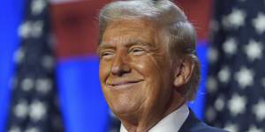 Donald Trump smiles at an election night watch party at the Palm Beach Convention Centre.