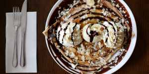Colossal:A crepe with chocolate,banana,whipped cream,almonds and ice-cream.