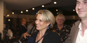 Katherine Deves is escorted into a campaign event at Forestville RSL.