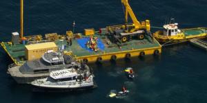 The wreck of the crashed jet on a barge in Port Phillip Bay on Saturday.