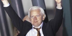 Assange gave two thumbs up as he stepped off the plane to applause in Canberra on Wednesday night.