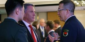 Australia’s Defence Minister Richard Marles (centre) with China’s Defence Minister Dong Jun,(right) at the Shangri-La Dialogue in Singapore.