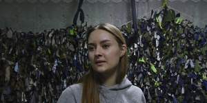 High school student Tetiana Onopriienko,16,is now volunteering to make camouflage nets - used by Ukrainian military,police and civil defence - in a community shelter in Uman. 