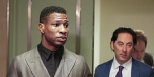Jonathan Majors (left),entering a courtroom at the Manhattan criminal courts,New York,this week.