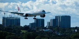 Man on Sydney-bound flight tried to open plane door mid-air,court told