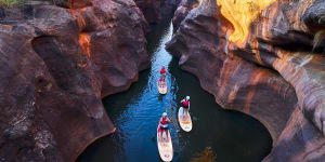 Spring-fed Cobbold Gorge flows year-round,and SUPing is a gentle and immersive way to explore it.